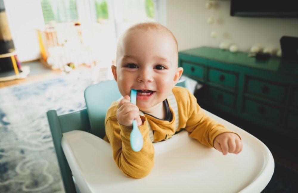 toddler boy in highchair - Nestlé
