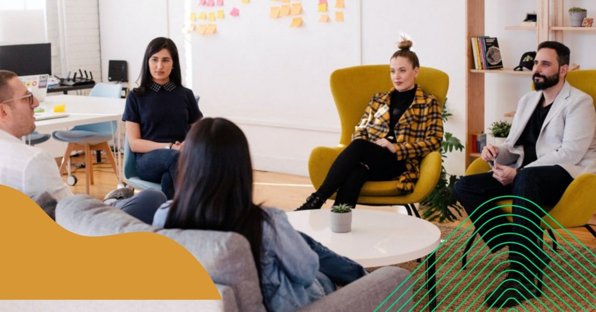 A group of startups around a table